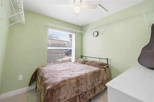 a bedroom with a bed and cabinets