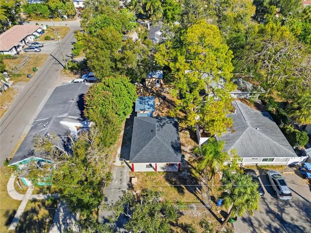 an aerial view of house with yard