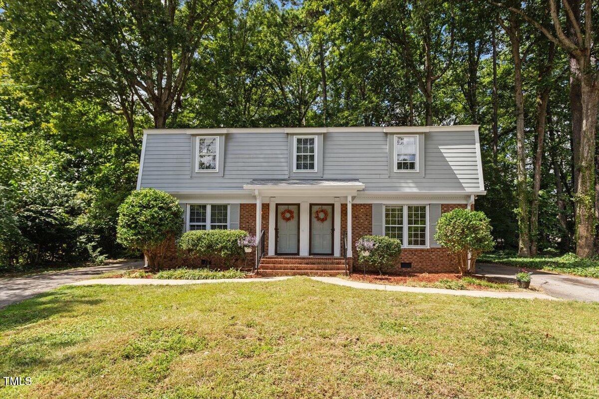 5309 Covey Court Raleigh, NC 27609 - Photo 1 of 47 a front view of a house with a yard