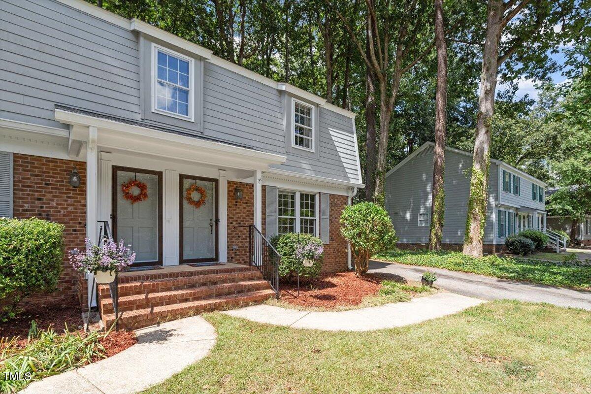 5309 Covey Court Raleigh, NC 27609 - Photo 10 of 47 a front view of a house with garden