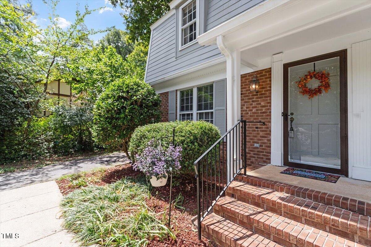 5309 Covey Court Raleigh, NC 27609 - Photo 12 of 47 front view of a house with a bench