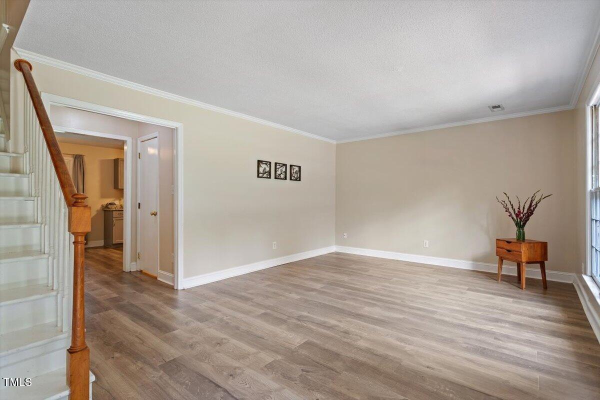 5309 Covey Court Raleigh, NC 27609 - Photo 14 of 47 wooden floor in an empty room with a window