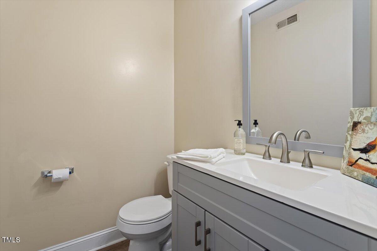 5309 Covey Court Raleigh, NC 27609 - Photo 18 of 47 a bathroom with a sink and a toilet