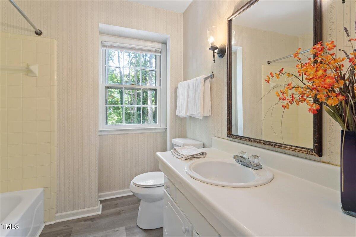 5309 Covey Court Raleigh, NC 27609 - Photo 25 of 47 a bathroom with a sink toilet and shower