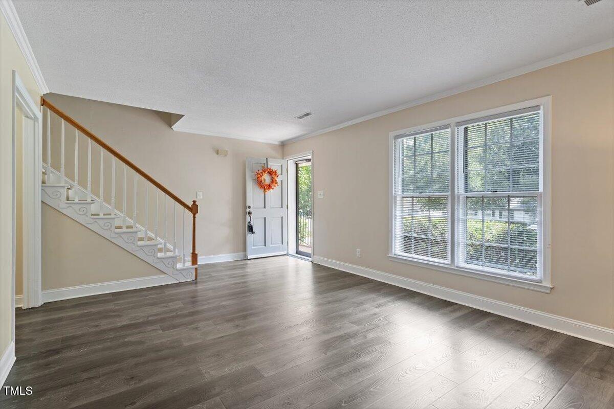 5309 Covey Court Raleigh, NC 27609 - Photo 31 of 47 a view of an entryway with wooden floor