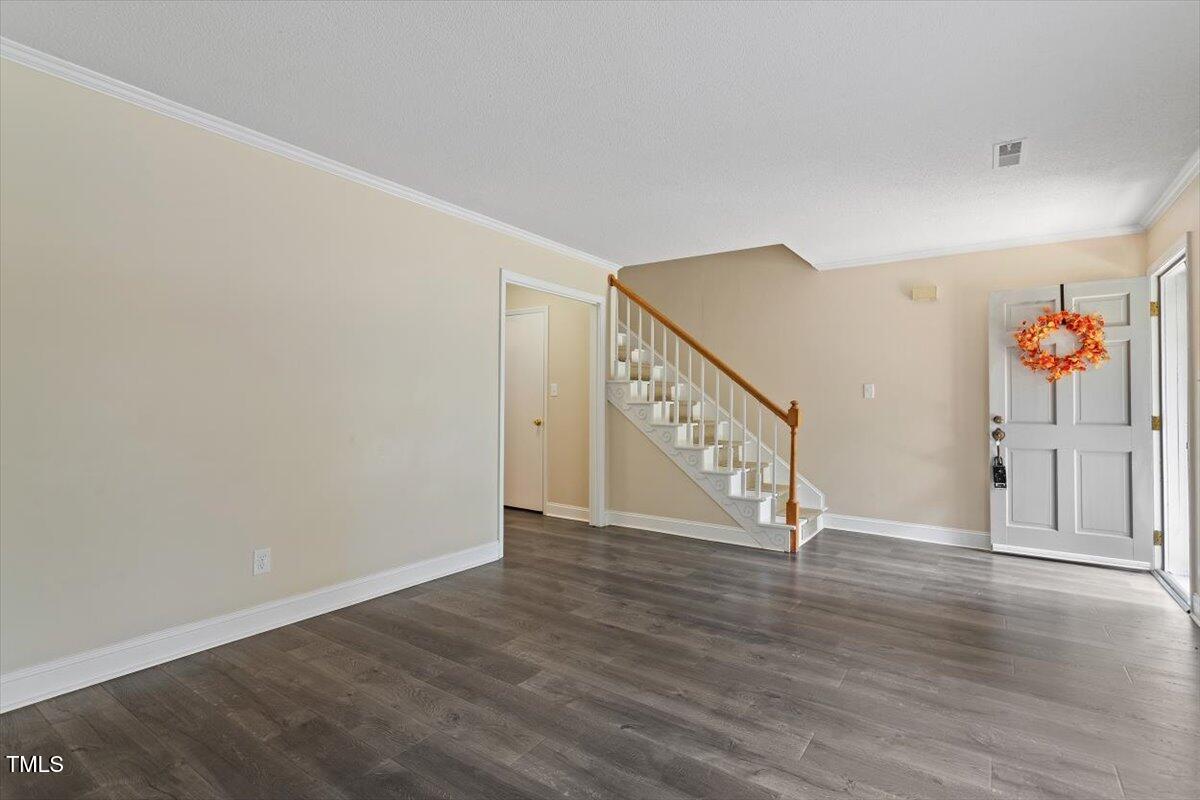 5309 Covey Court Raleigh, NC 27609 - Photo 32 of 47 a view of an entryway with wooden floor
