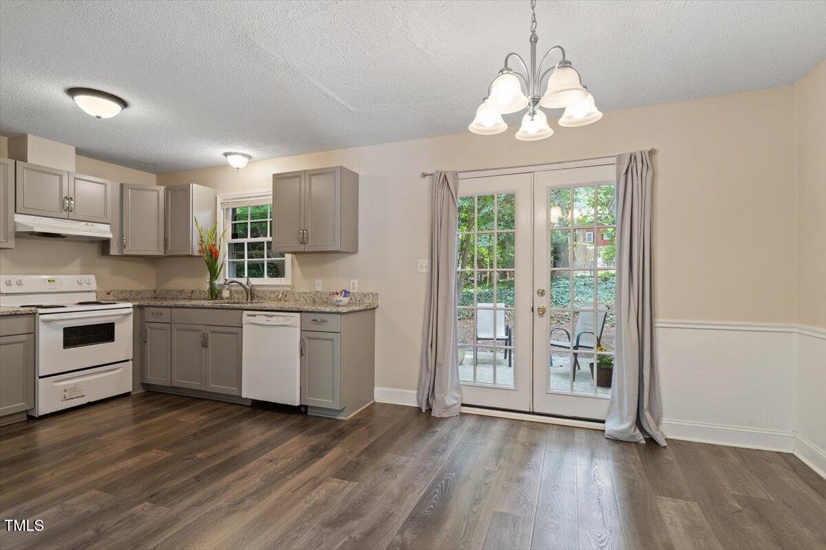 5309 Covey Court Raleigh, NC 27609 - Photo 34 of 47 a kitchen with a white cabinets and window