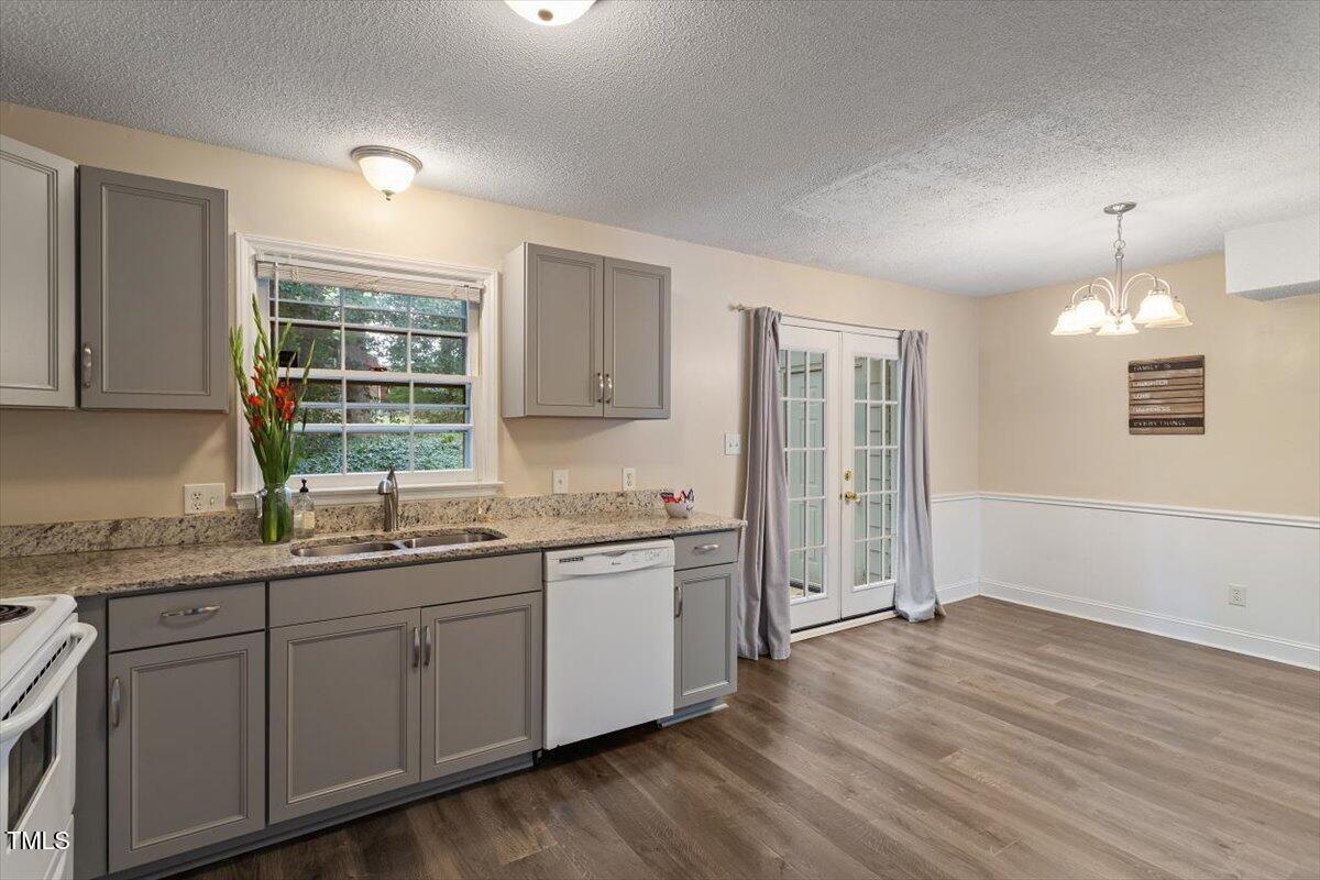 5309 Covey Court Raleigh, NC 27609 - Photo 38 of 47 a kitchen with a sink cabinets and window