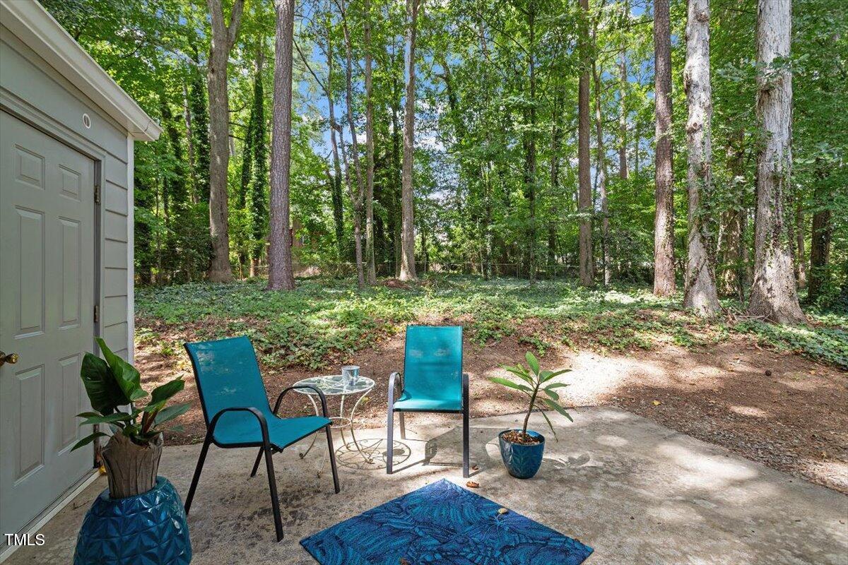 5309 Covey Court Raleigh, NC 27609 - Photo 45 of 47 a view of a table and chairs in the garden