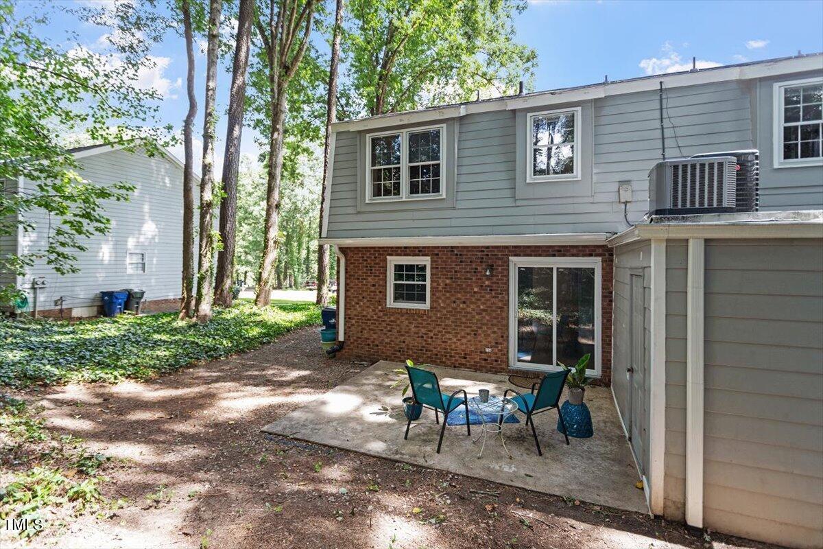 5309 Covey Court Raleigh, NC 27609 - Photo 6 of 47 a view of a house with backyard and chairs