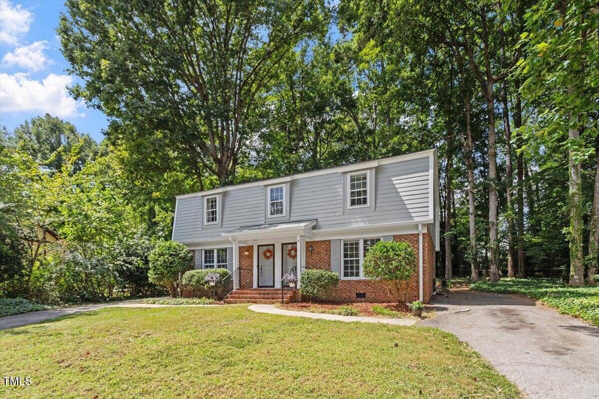 5309 Covey Court Raleigh, NC 27609 - Photo 8 of 47 a front view of a house with a yard table and chairs