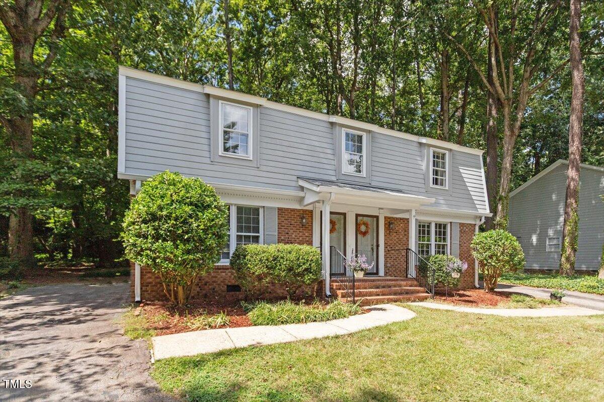 5309 Covey Court Raleigh, NC 27609 - Photo 9 of 47 a view of a house with yard and sitting area