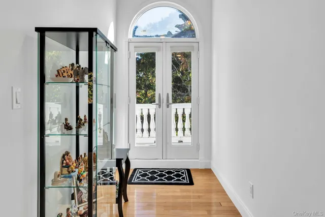 a view of a entryway door and hallway