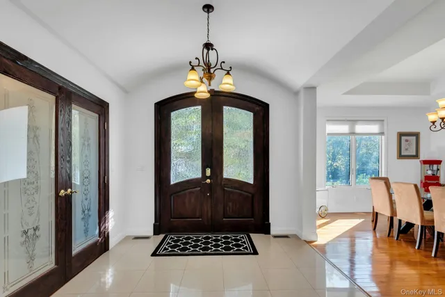 a view of a livingroom with furniture and hardwood floor