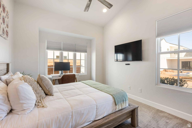 4222 Hampshire Road Hurricane, UT 84737 - Photo 10 of 12 Bright bedroom featuring a vaulted ceiling and an integrated ceiling fan