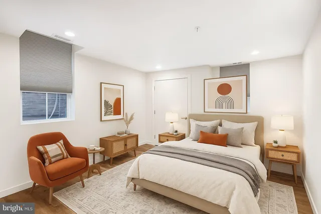 a bedroom with bed and window