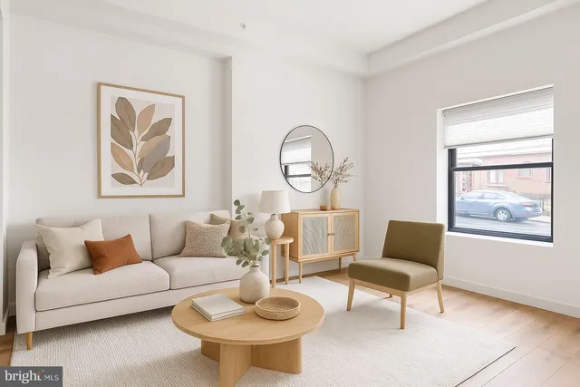 a living room with furniture a lamp and a window