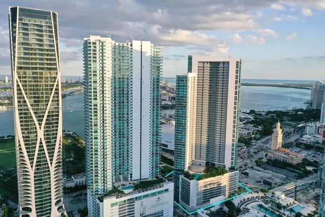a view of an buildings from the balcony