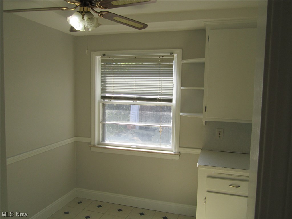3812 Warrendale Road Cleveland, OH 44118 - Photo 12 of 32 Kitchen area eat-in space with display shelves