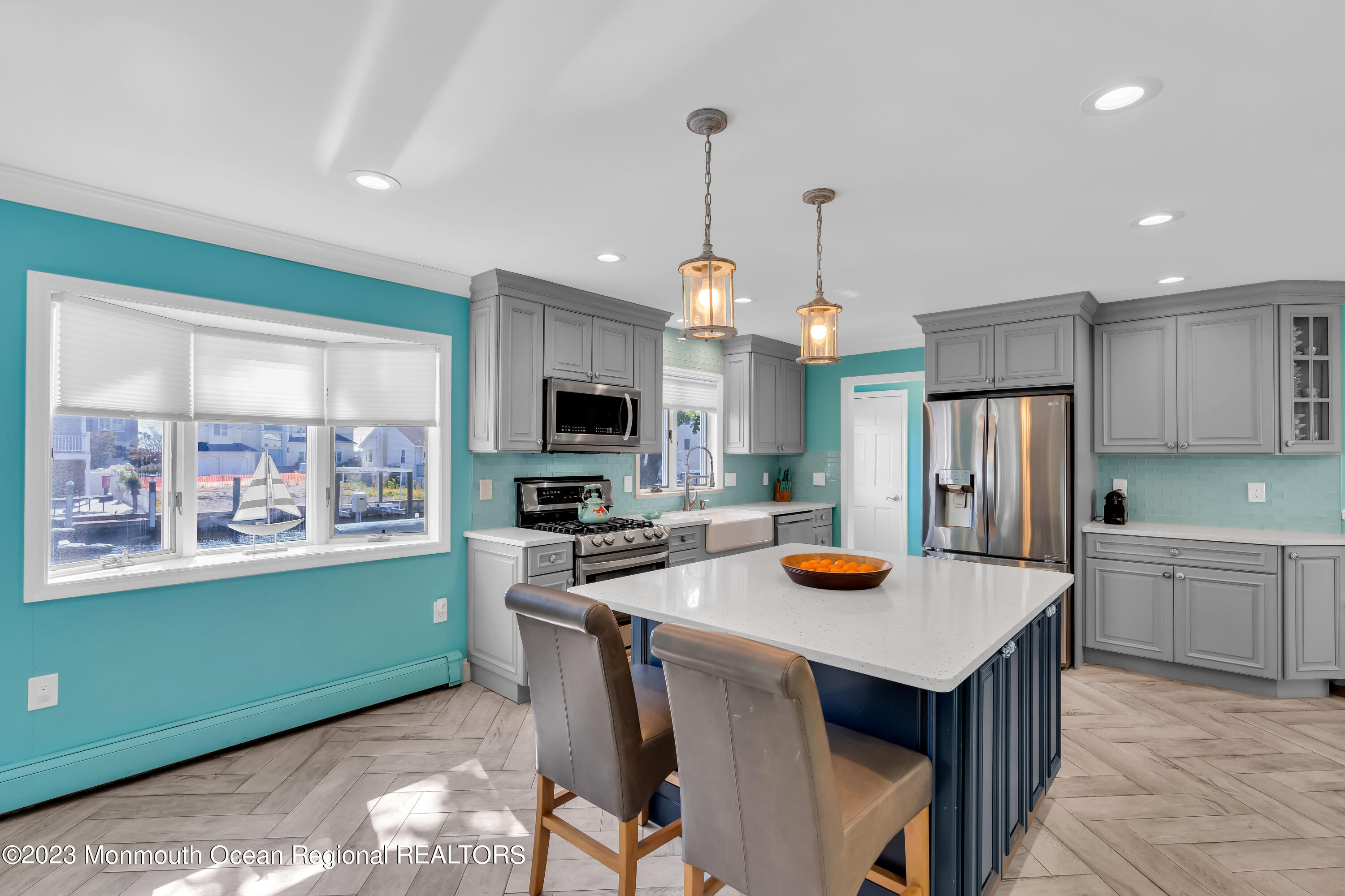 1801 Boat Point Drive Point Pleasant, NJ 08742 - Photo 22 of 76 a kitchen with sink a refrigerator and wooden cabinets