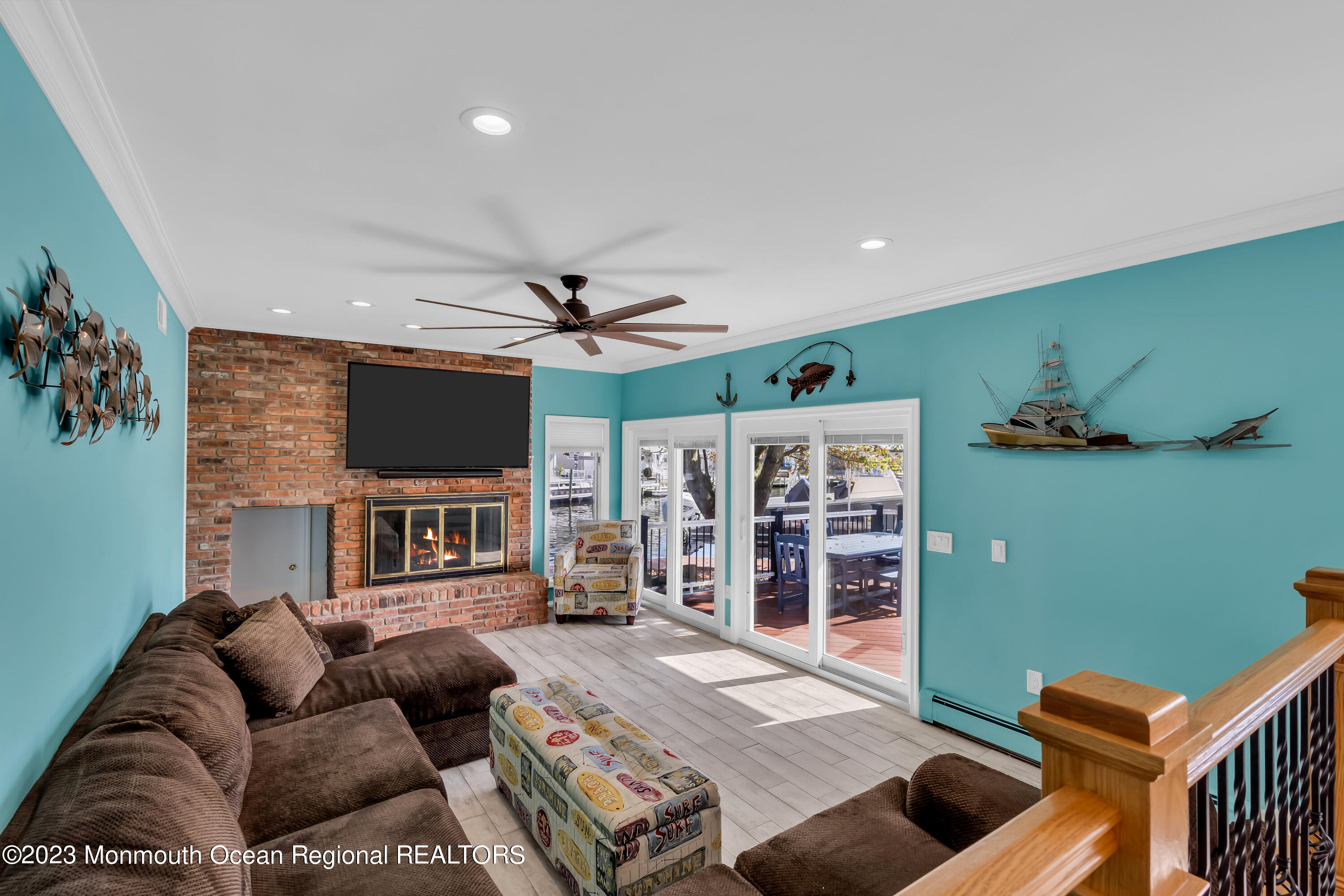 1801 Boat Point Drive Point Pleasant, NJ 08742 - Photo 25 of 76 a living room with furniture a flat screen tv and kitchen view