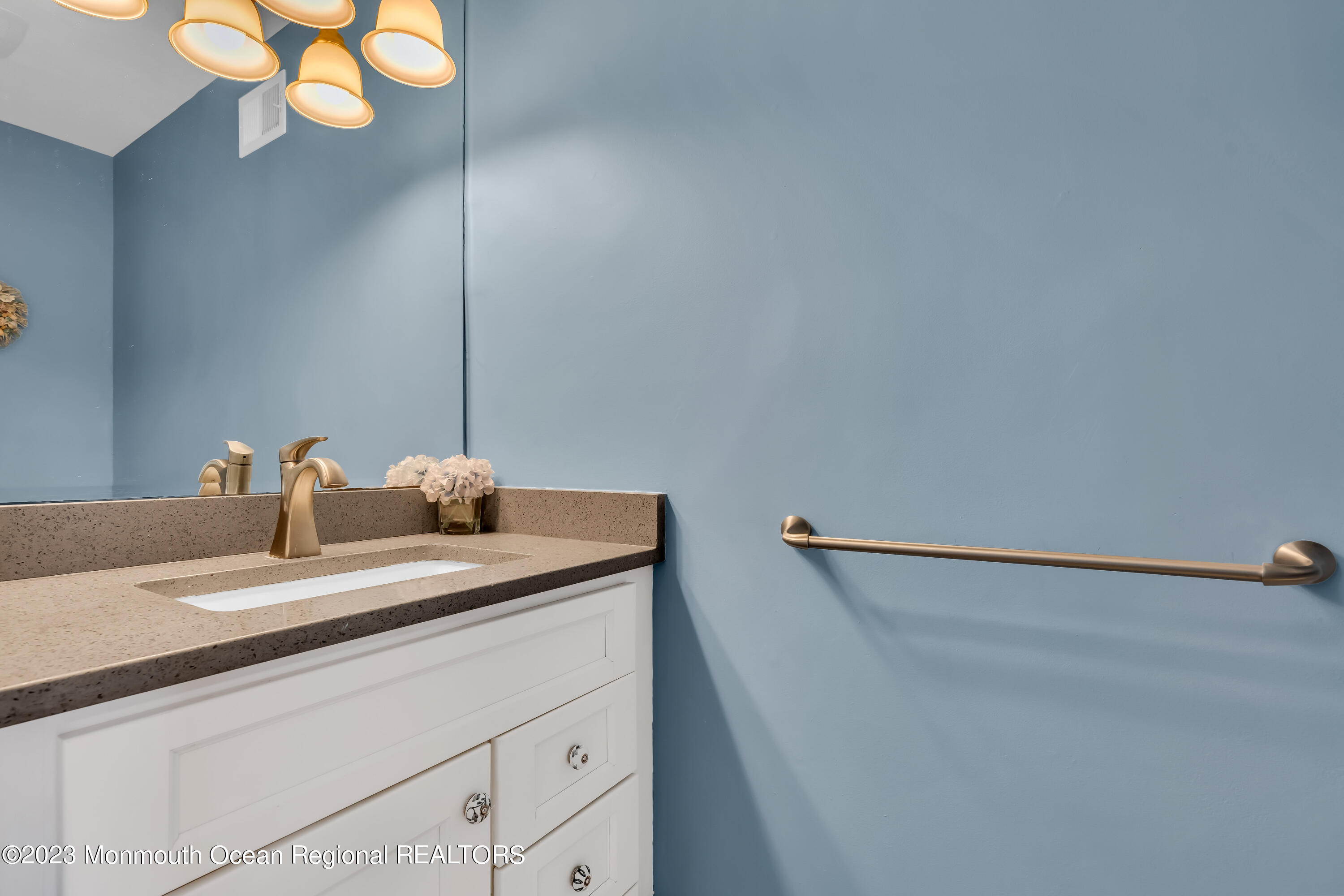 1801 Boat Point Drive Point Pleasant, NJ 08742 - Photo 27 of 76 a bathroom with a sink and a mirror