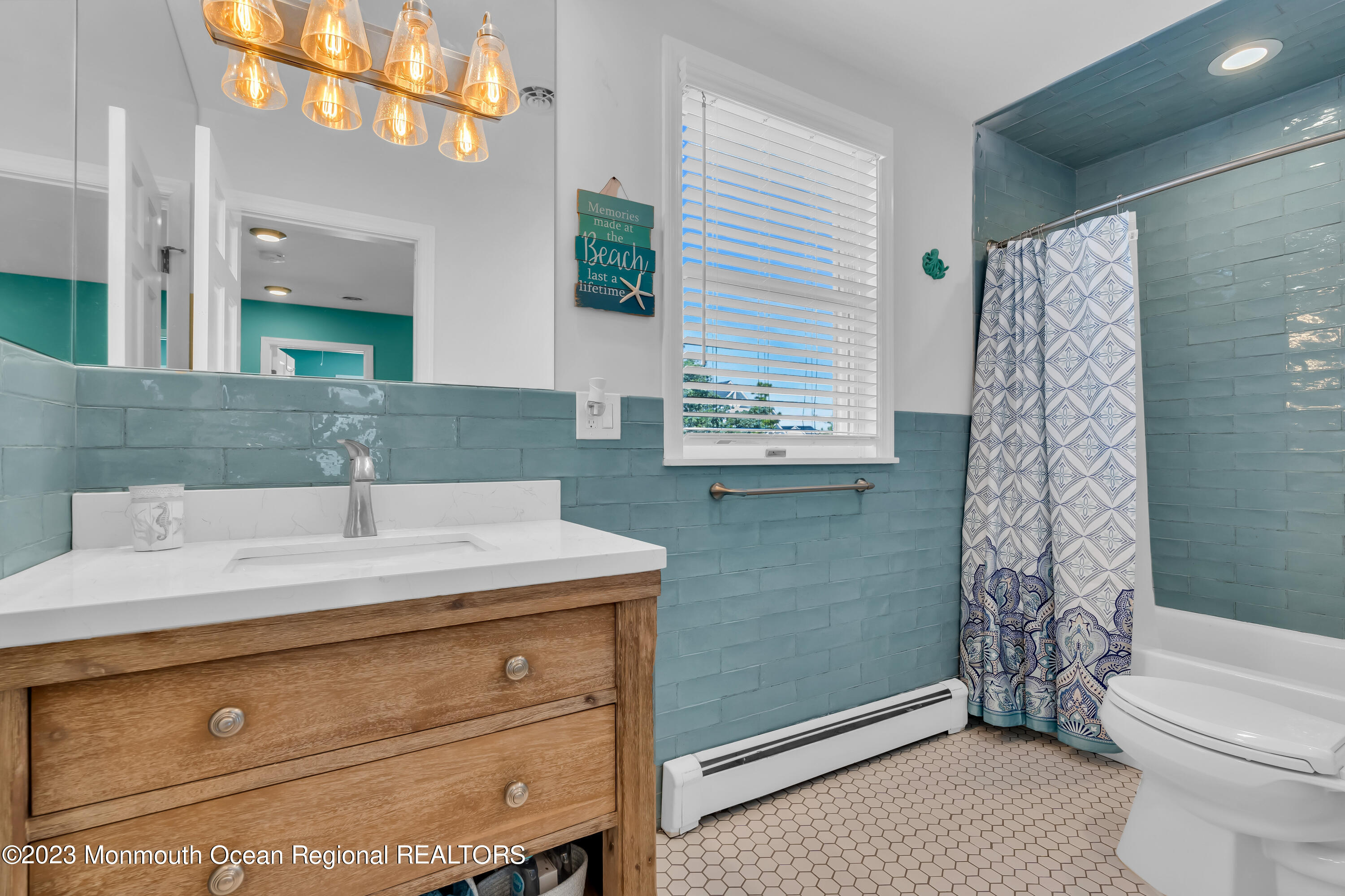 1801 Boat Point Drive Point Pleasant, NJ 08742 - Photo 29 of 76 a bathroom with a granite countertop sink a toilet and shower