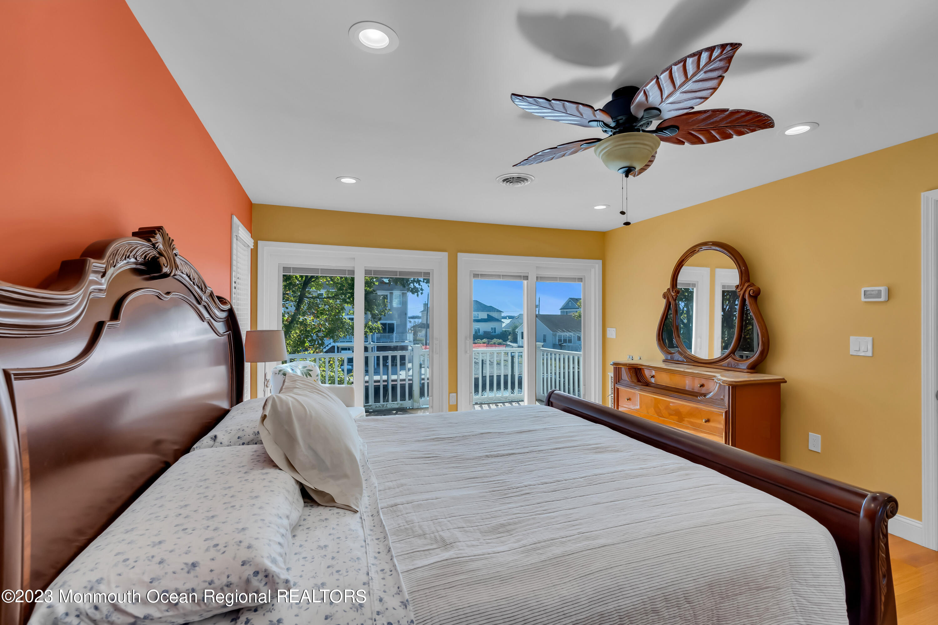 1801 Boat Point Drive Point Pleasant, NJ 08742 - Photo 38 of 76 a bedroom with a bed dresser and a large window