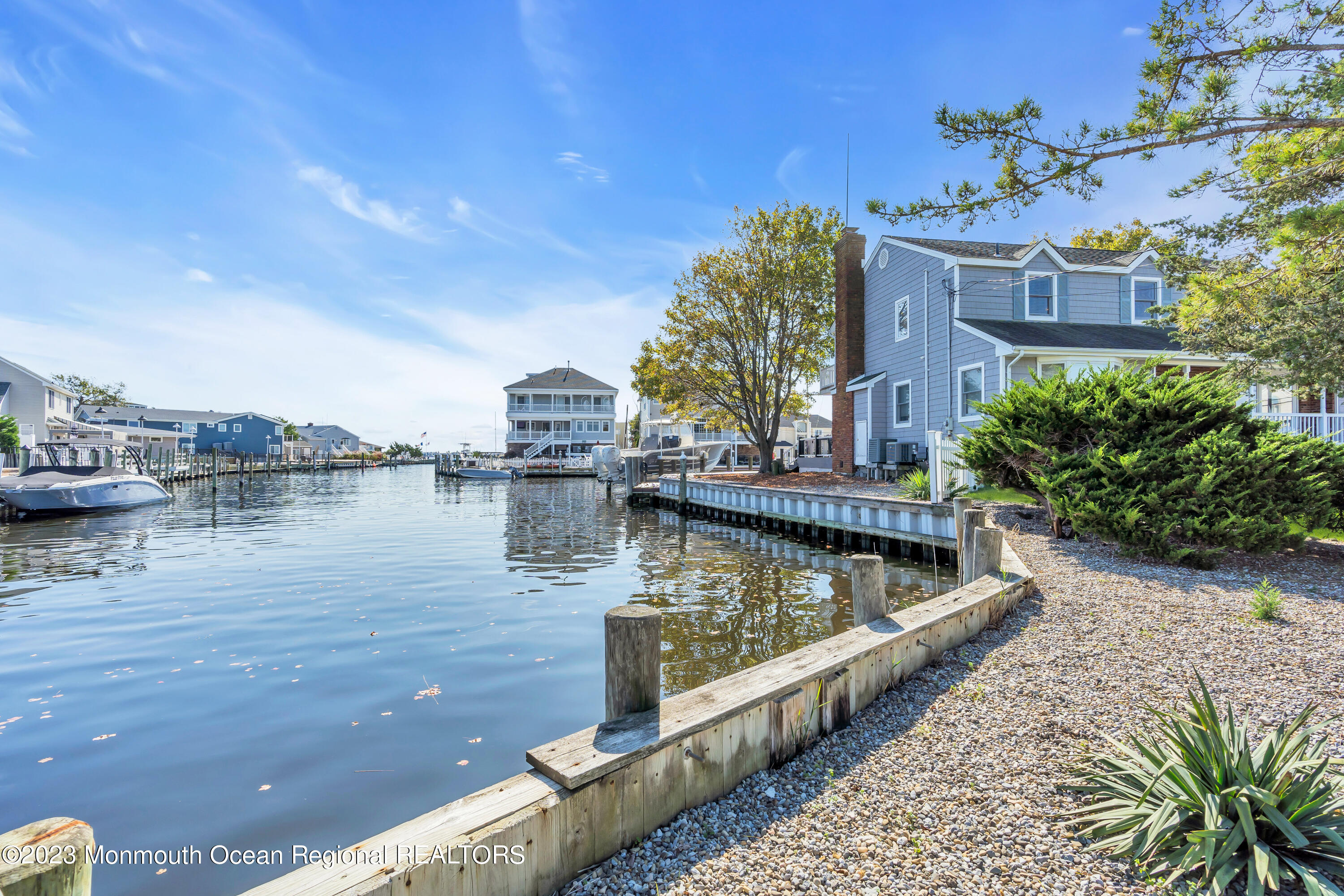 1801 Boat Point Drive Point Pleasant, NJ 08742 - Photo 46 of 76 a view of a lake with a building in the background