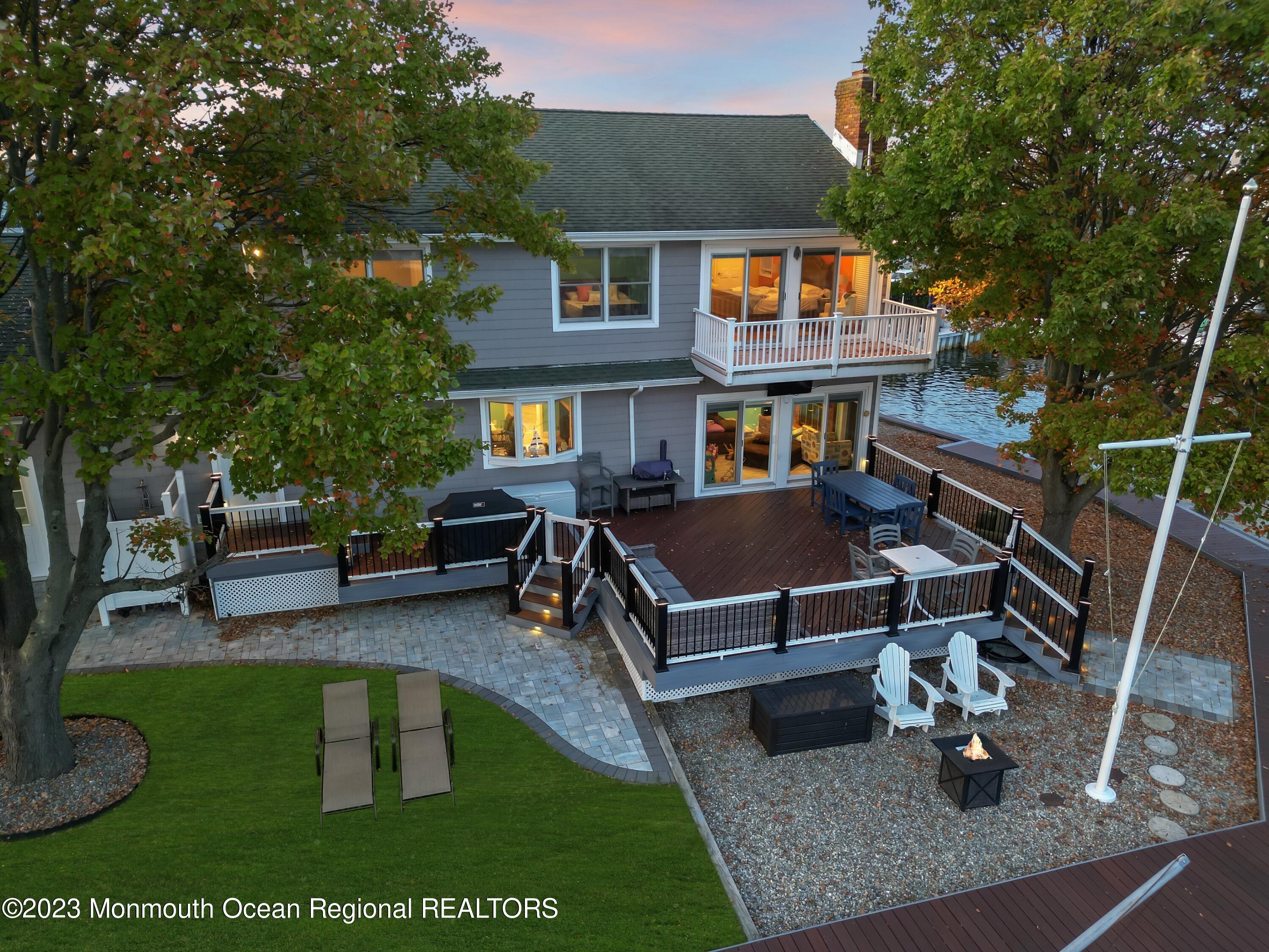 1801 Boat Point Drive Point Pleasant, NJ 08742 - Photo 65 of 76 a view of a house with backyard porch and sitting area