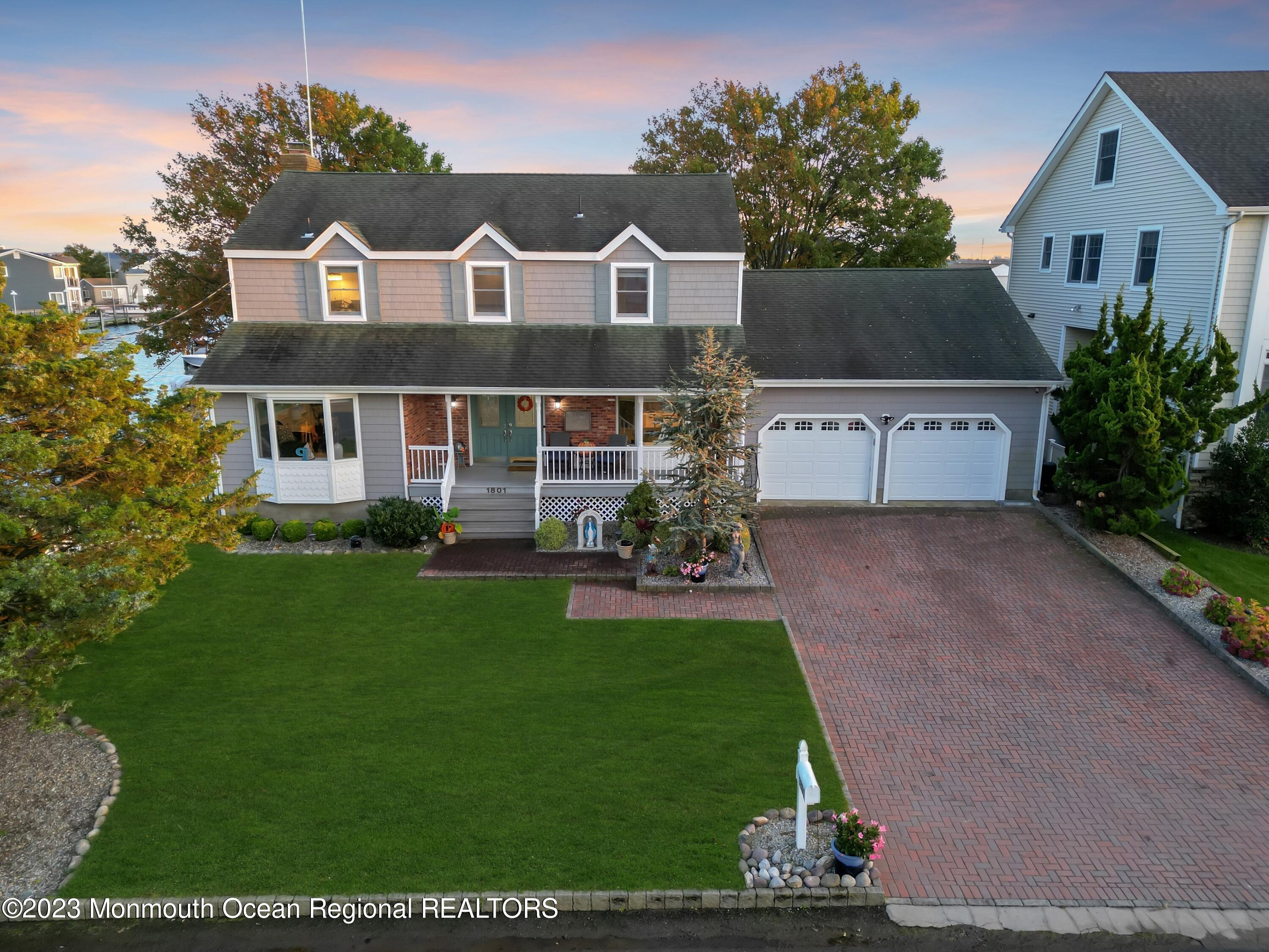1801 Boat Point Drive Point Pleasant, NJ 08742 - Photo 67 of 76 a front view of a house with a yard