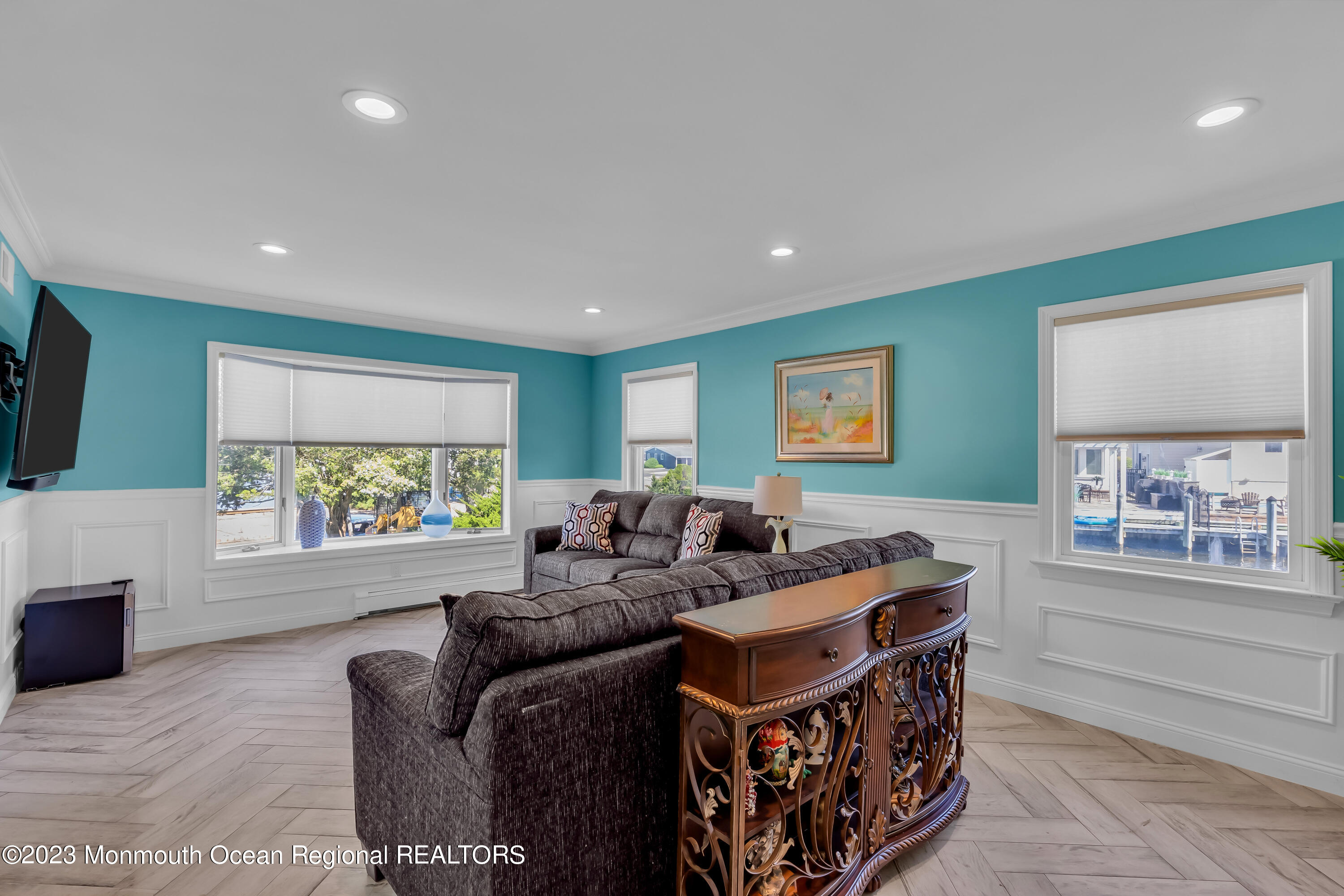 1801 Boat Point Drive Point Pleasant, NJ 08742 - Photo 10 of 76 a living room with furniture a large window and a flat screen tv