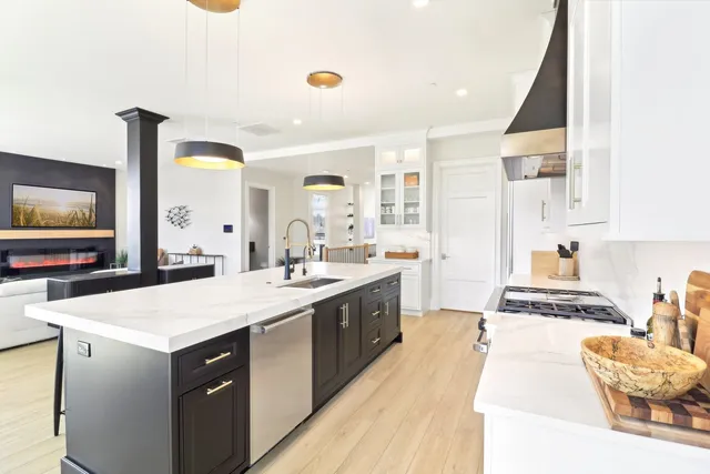 a kitchen with a sink stove and cabinets