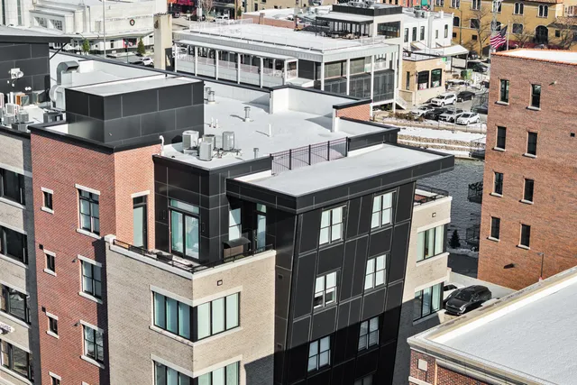 a front view of a building with a lot of windows