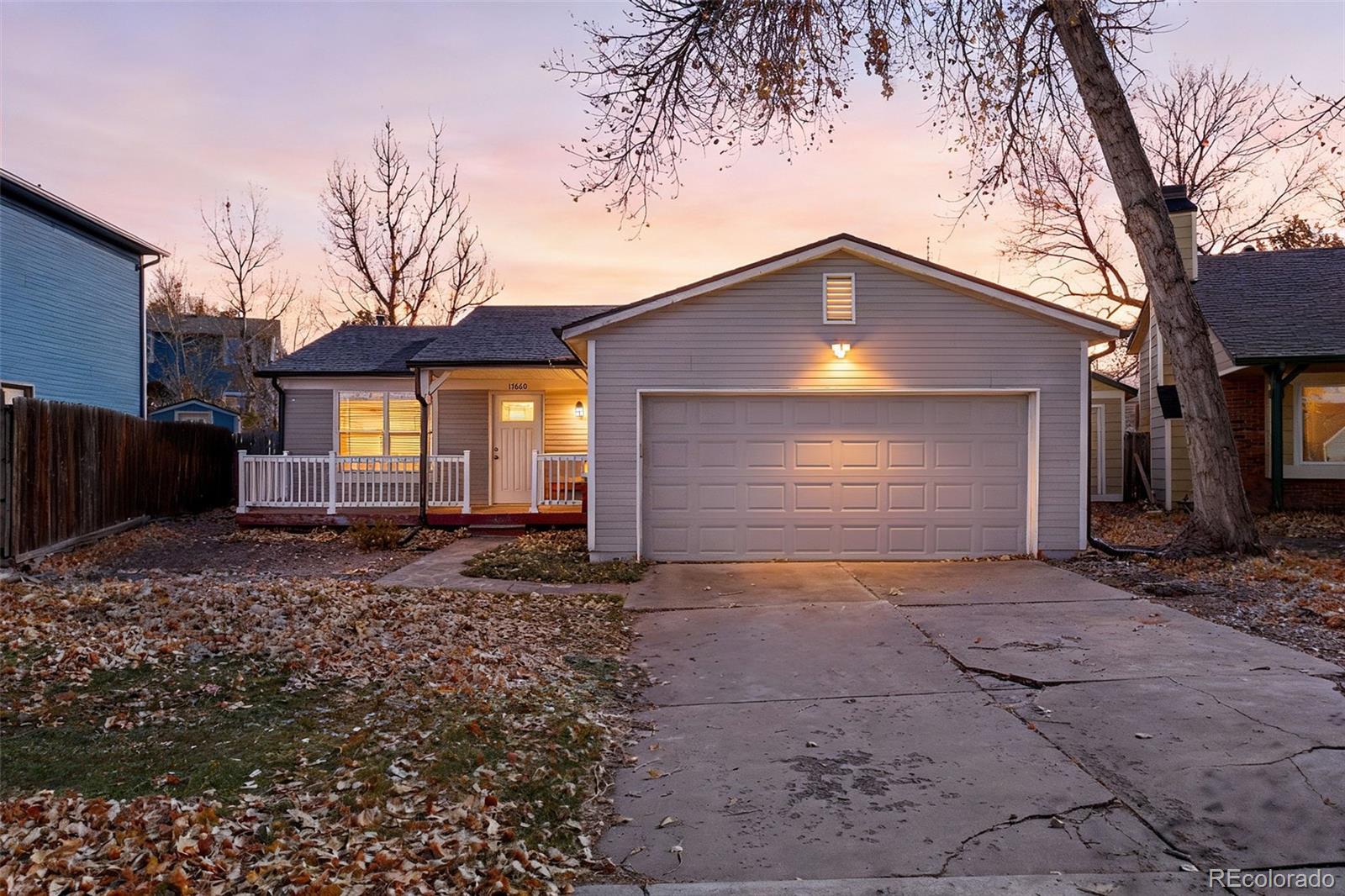 17660 Snowberry Way Parker, CO 80134 - Photo 1 of 38 a front view of a house with a yard and garage