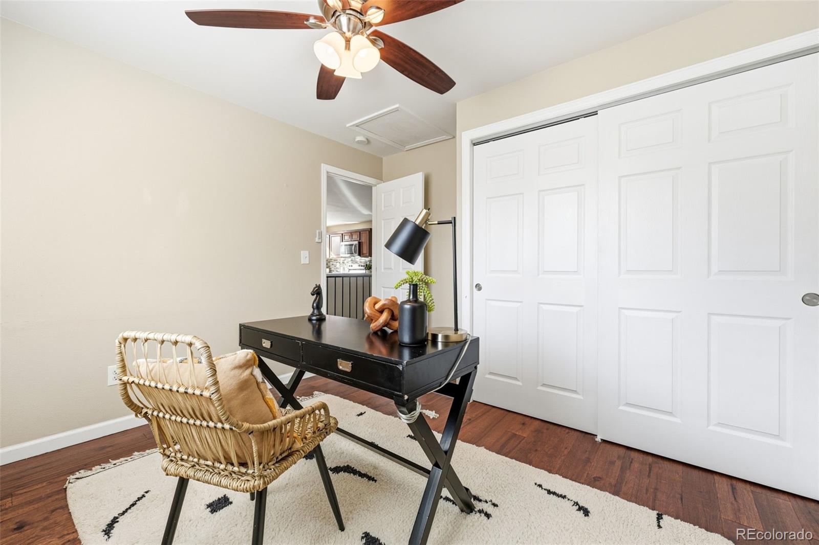 17660 Snowberry Way Parker, CO 80134 - Photo 19 of 38 a view of a workspace with furniture and wooden floor