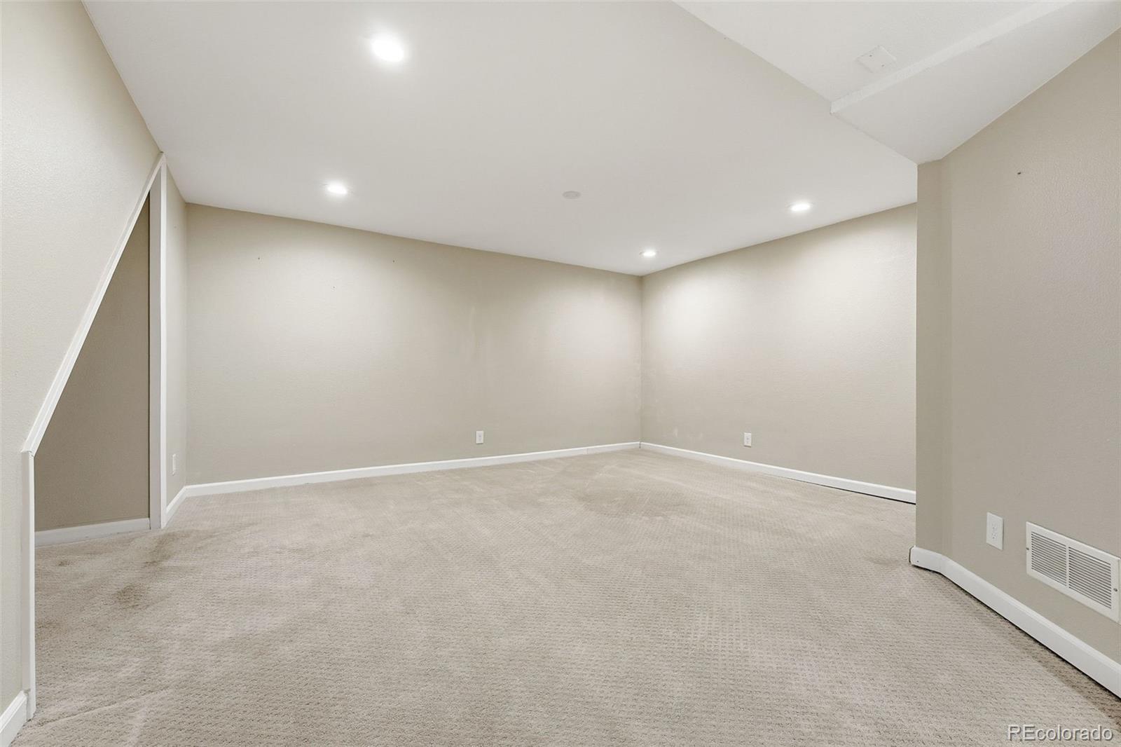 17660 Snowberry Way Parker, CO 80134 - Photo 29 of 38 an empty room with a empty space and windows