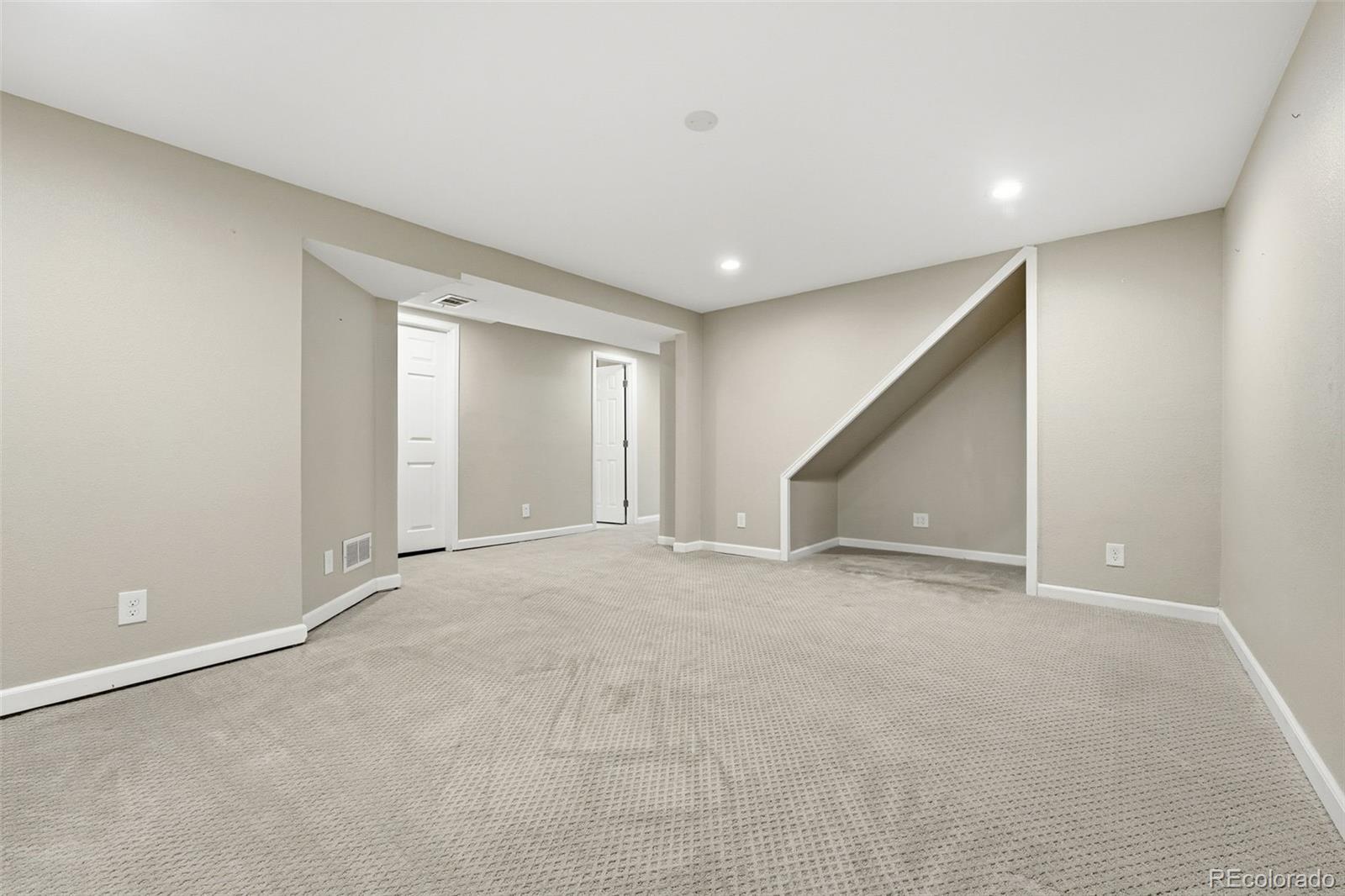 17660 Snowberry Way Parker, CO 80134 - Photo 30 of 38 a view of an empty room with a window