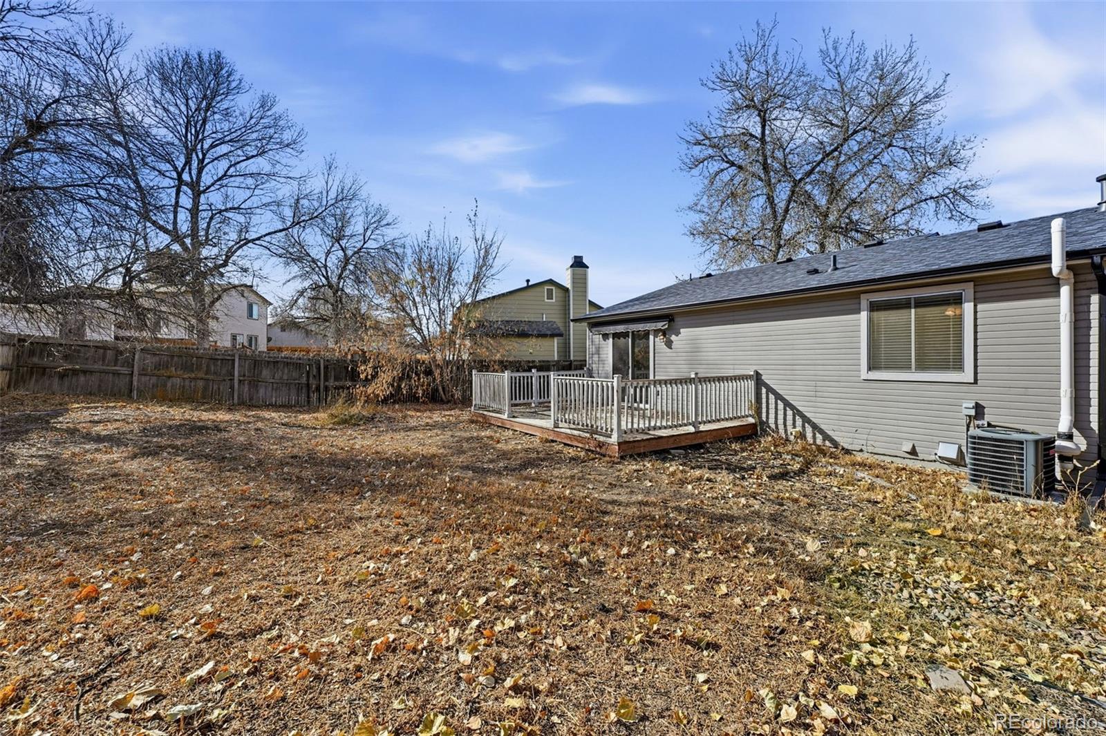 17660 Snowberry Way Parker, CO 80134 - Photo 35 of 38 a house with trees in front of it