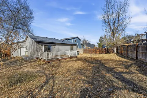 a picture of a bench in front of a building