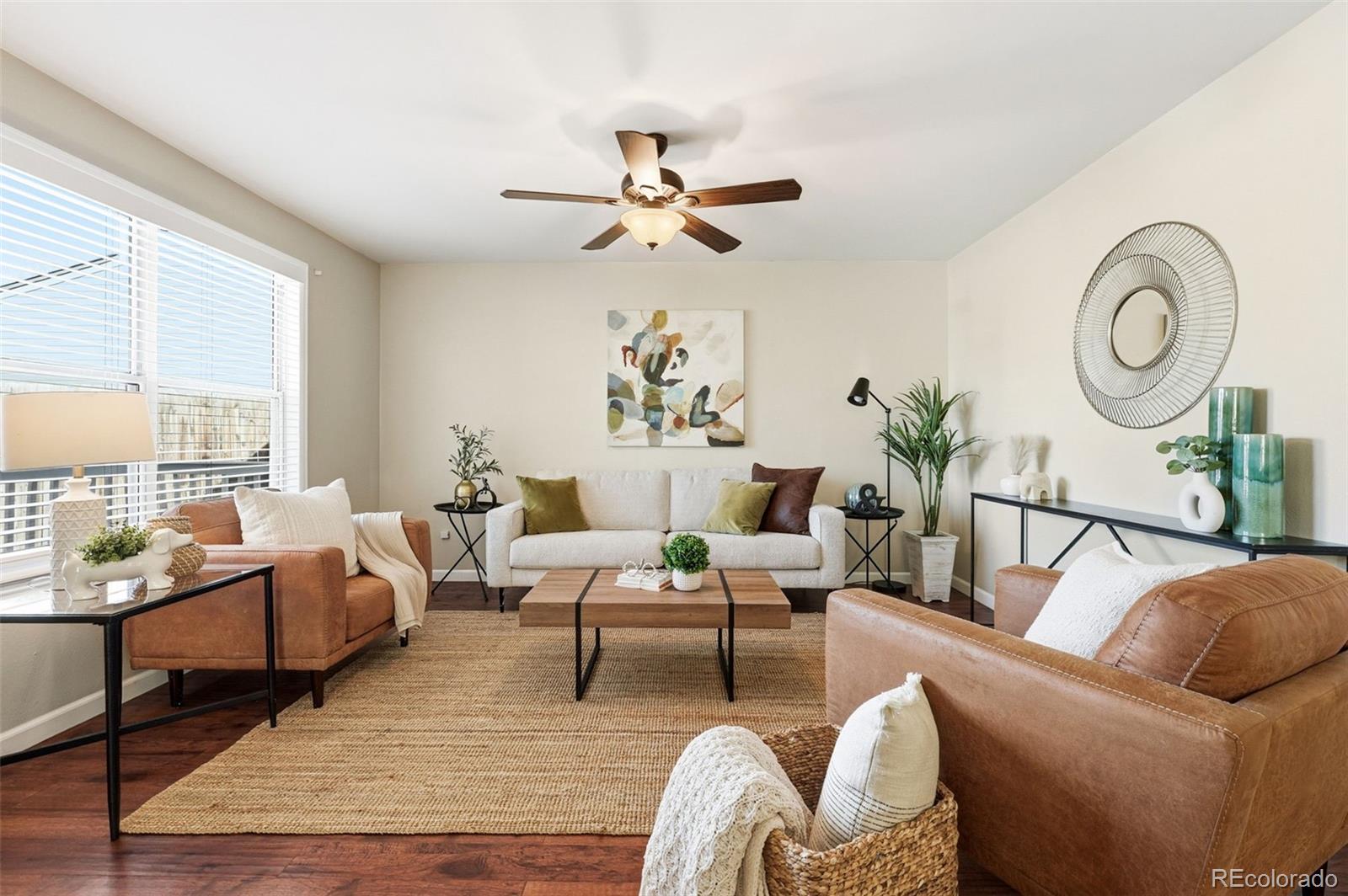 17660 Snowberry Way Parker, CO 80134 - Photo 5 of 38 a living room with furniture and a large window