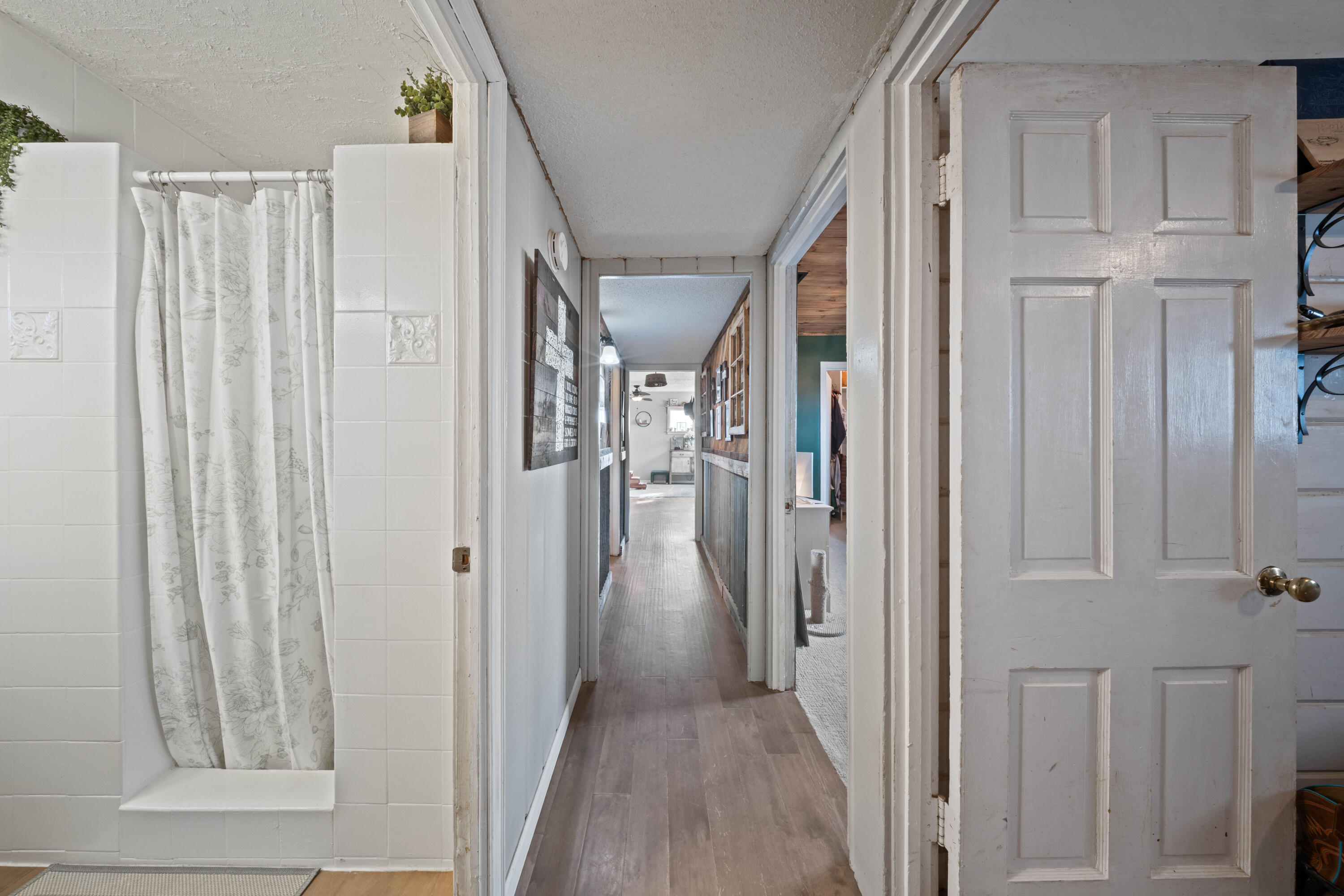 3725 Hawk Road Ropesville, TX 79358 - Photo 23 of 39 a view of a hallway with wooden floor and staircase