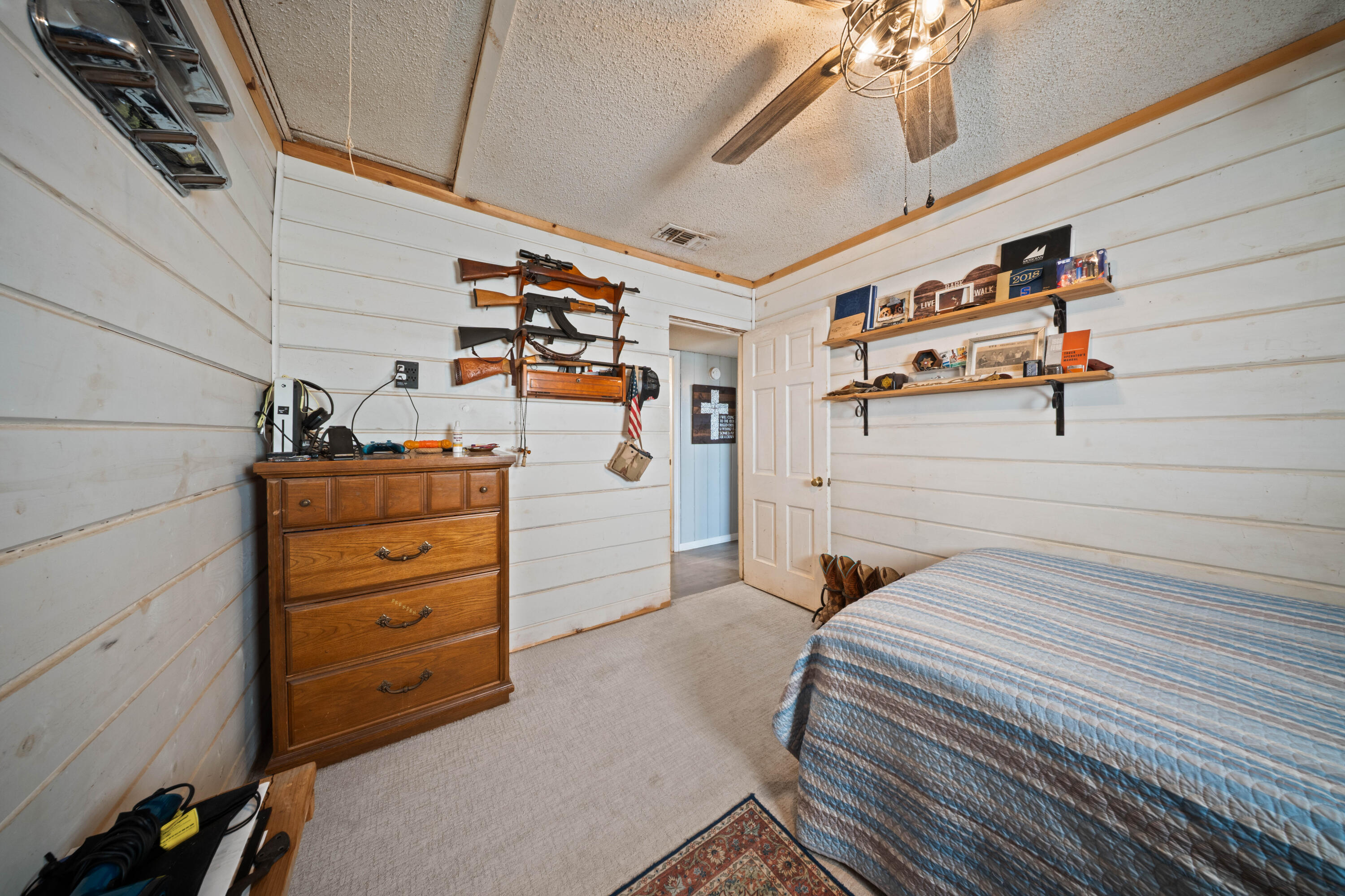 3725 Hawk Road Ropesville, TX 79358 - Photo 30 of 39 a bedroom with a bed and a cabinets