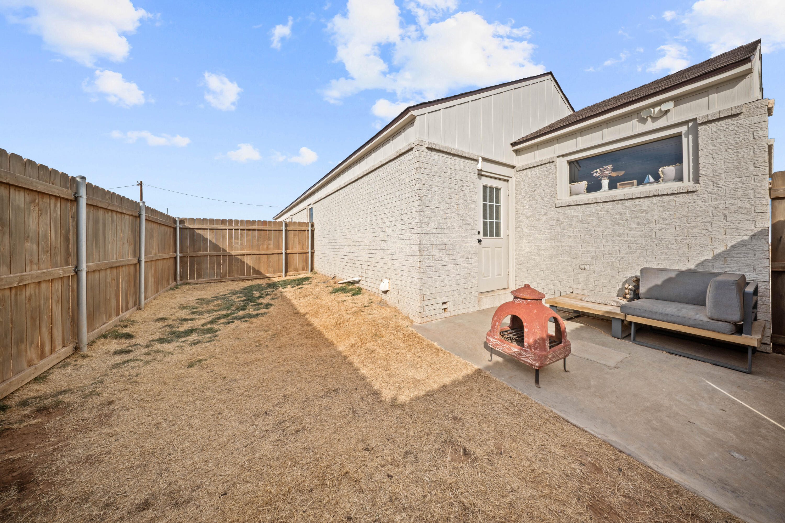 3725 Hawk Road Ropesville, TX 79358 - Photo 32 of 39 a backyard of a house with table and chairs