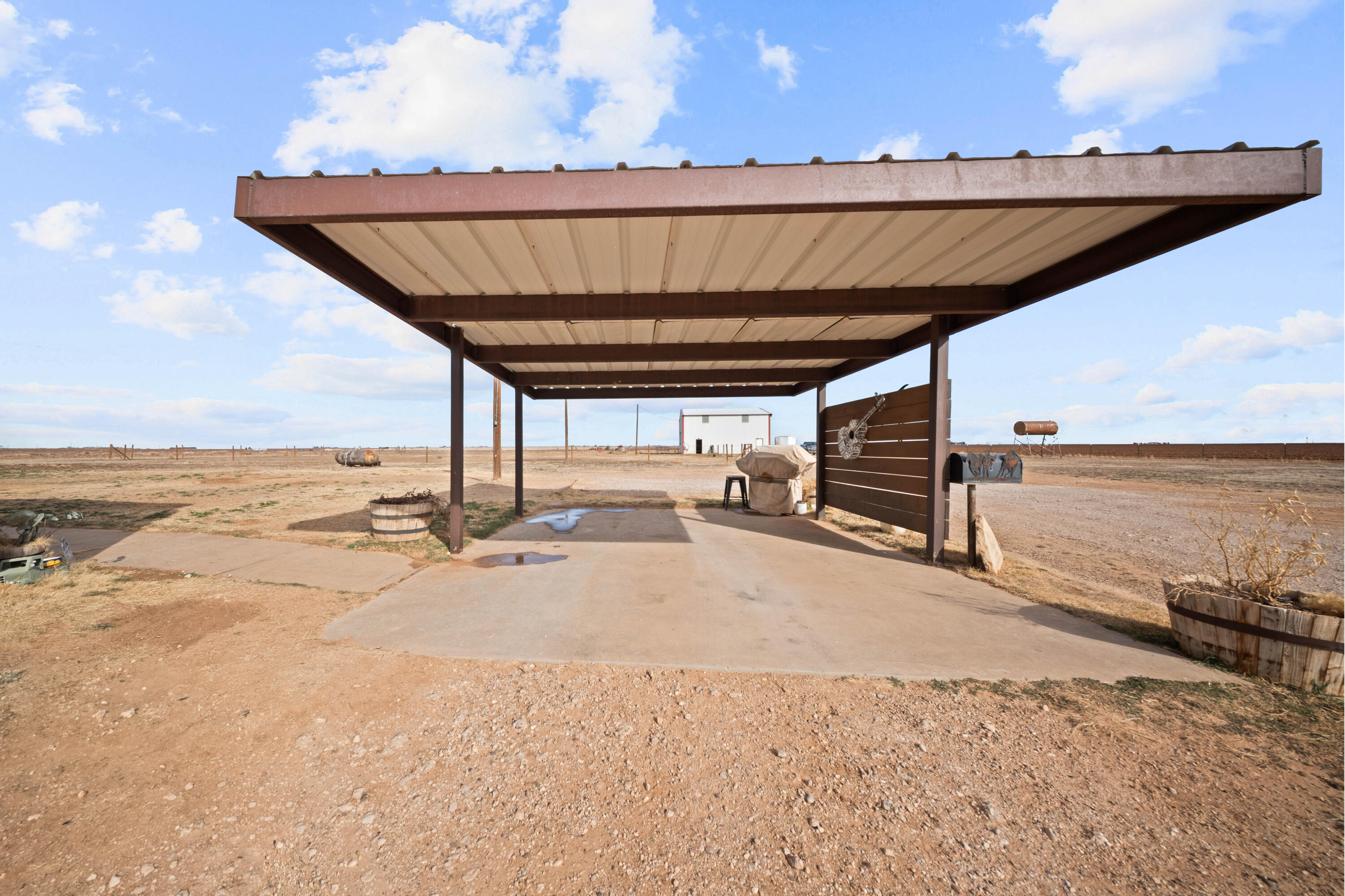 3725 Hawk Road Ropesville, TX 79358 - Photo 33 of 39 a view of a wooden deck with a ocean view