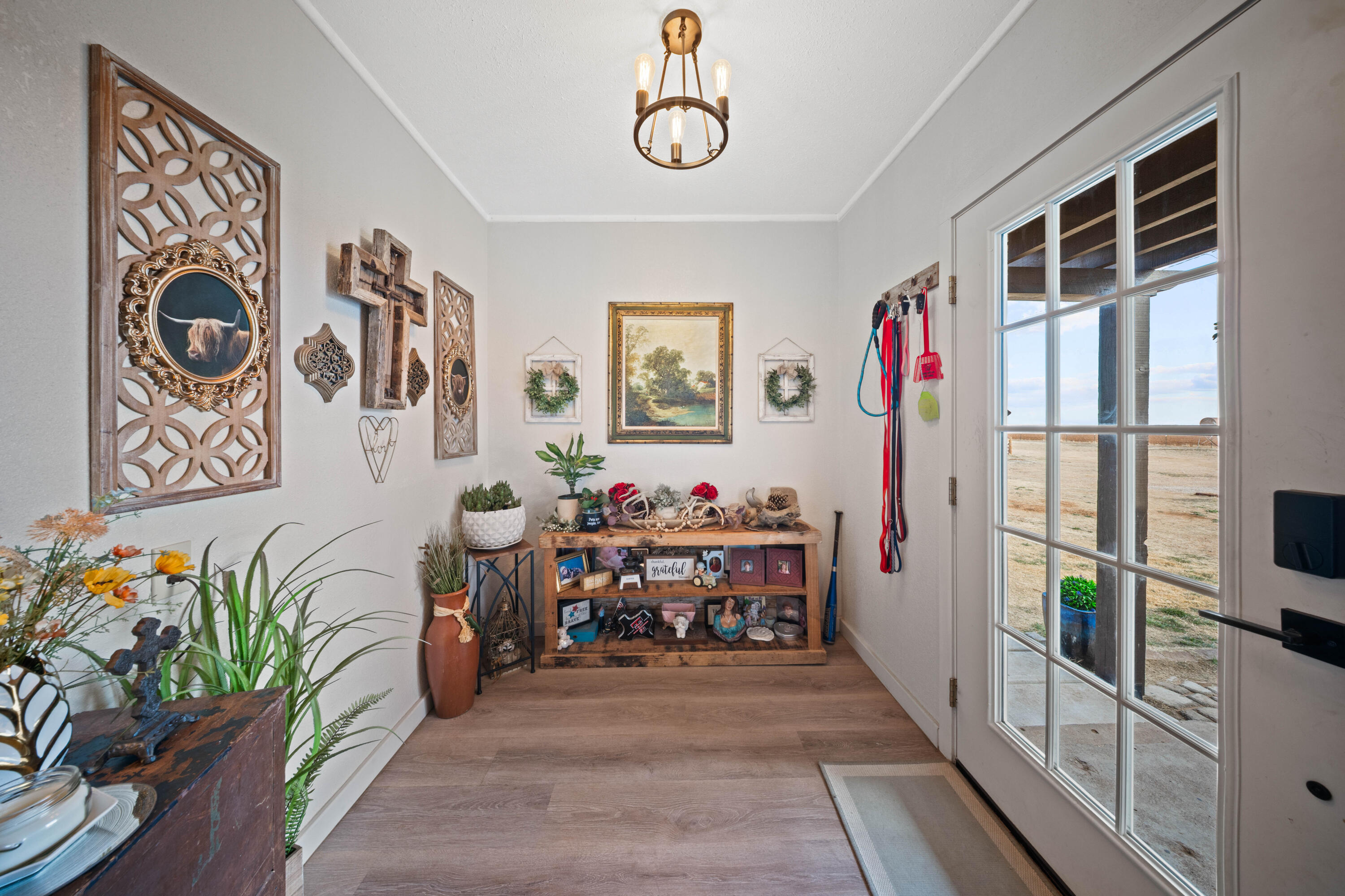 3725 Hawk Road Ropesville, TX 79358 - Photo 6 of 39 a view of a hallway with workspace and natural light