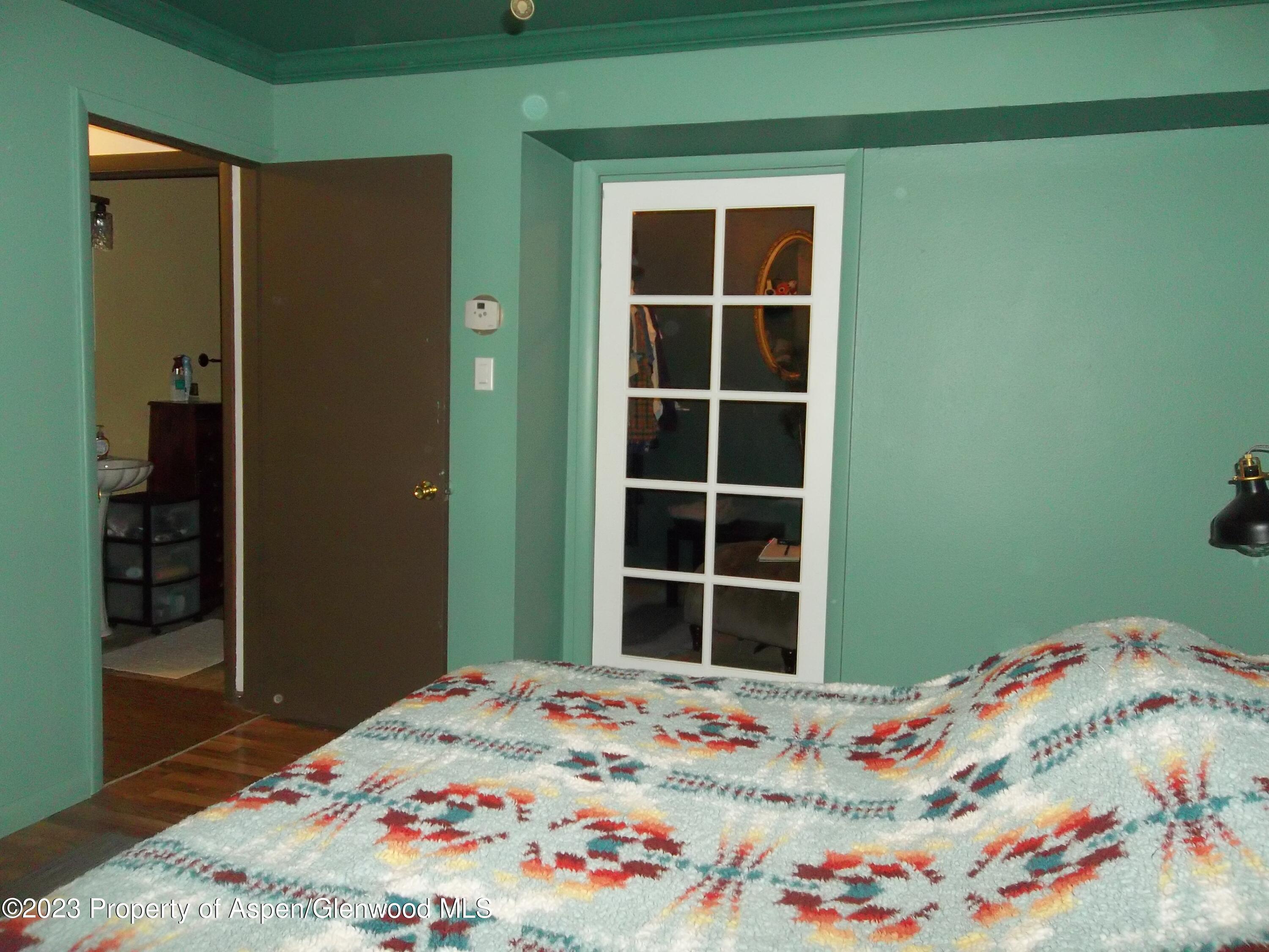 500 Wamsley Way Rifle, CO 81650 - Photo 13 of 21 a bedroom with a bed and a window
