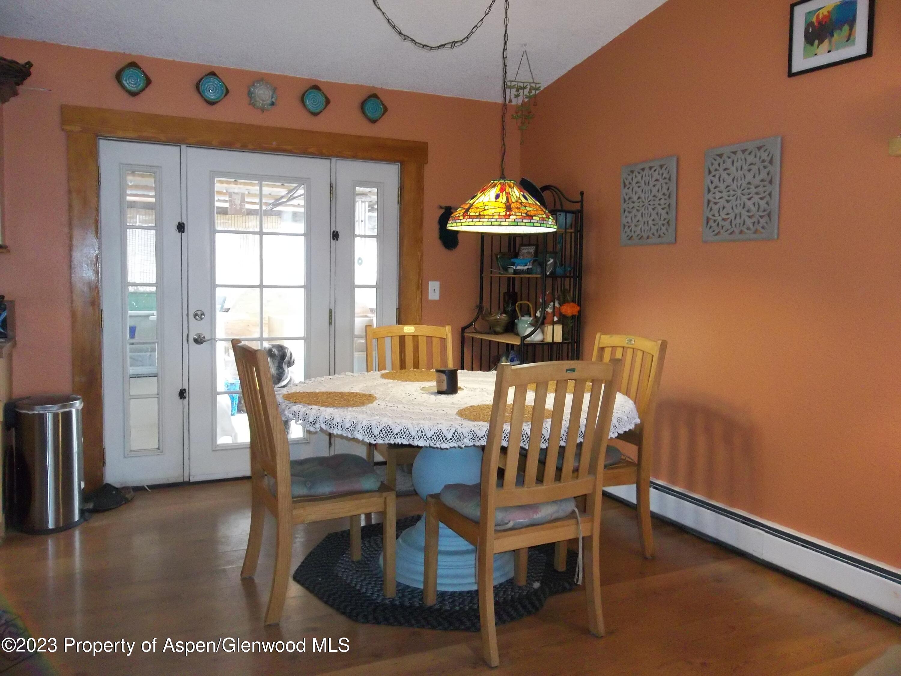 500 Wamsley Way Rifle, CO 81650 - Photo 4 of 21 a view of a dining room with furniture window and wooden floor
