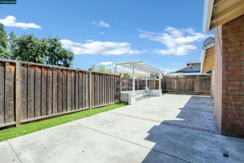 a view of a backyard with sitting area