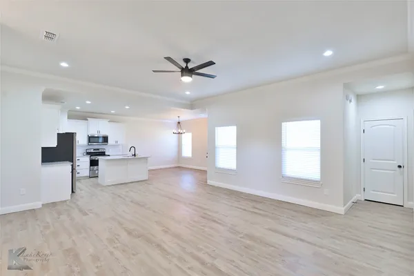 a view of kitchen with furniture and window
